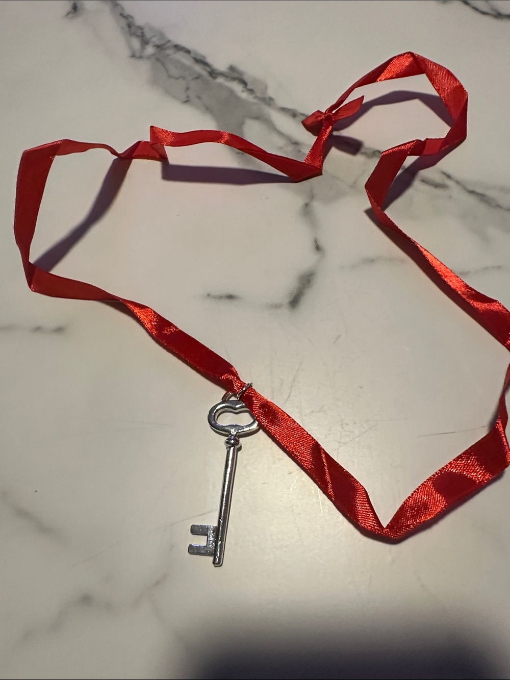 Red Ribbon Necklace with Silver Key Pendant